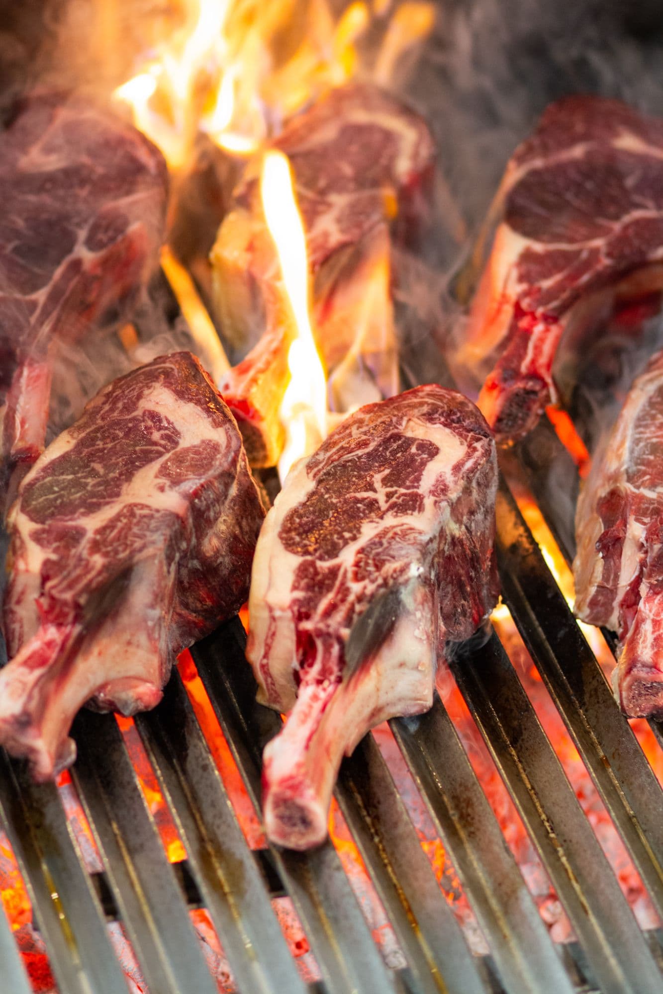 Côtes de boeuf above the flames of the charcoal grill