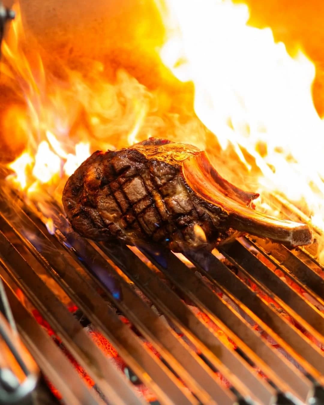 Meat on the charcoal grill at Tjaps